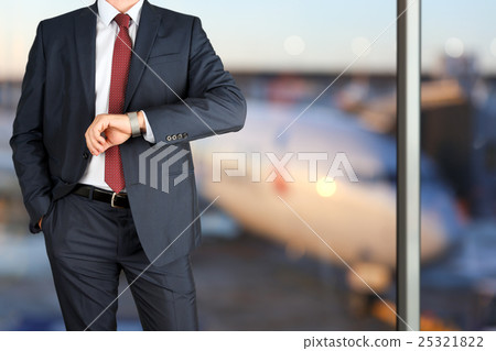 businessman checking time on his watch. Airport 25321822