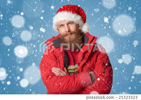 bright picture of handsome man in christmas hat. bright picture of handsome man in christmas hat. 25323323