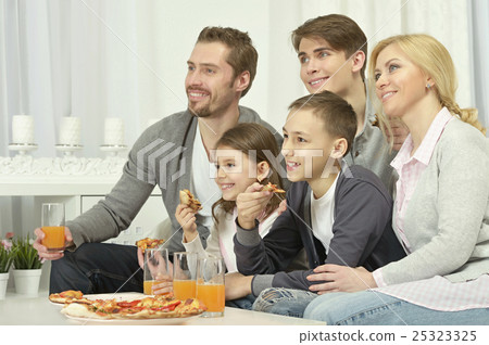 family at home with pizza family at home with pizza 25323325