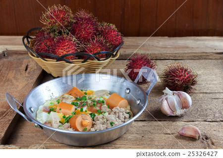 Egg frying pan and Rambutan fruit 25326427