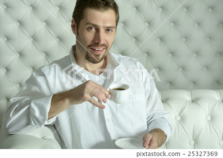 man  having coffee at home 25327369