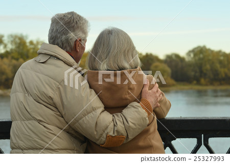 Happy senior couple near river Happy senior couple near river 25327993