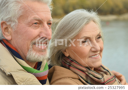 Happy senior couple near river Happy senior couple near river 25327995