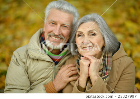 Senior couple in autumn park Senior couple in autumn park 25327997