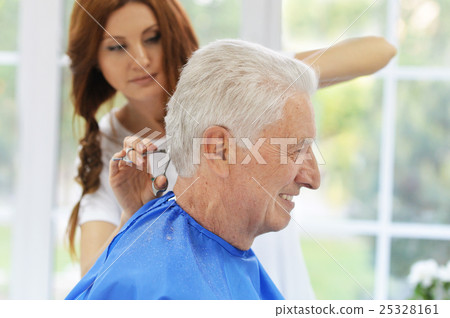 Man having a haircut from hairdresser Man having a haircut from hairdresser 25328161