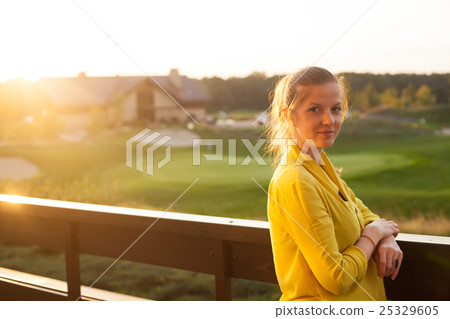 Woman standing on the terrace 25329605