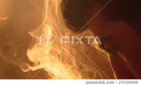 man breathes out smoke man breathes out smoke 25330409