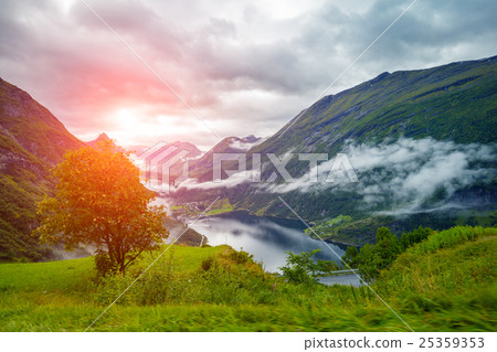 Geiranger fjord at sunset Geiranger fjord at sunset 25359353