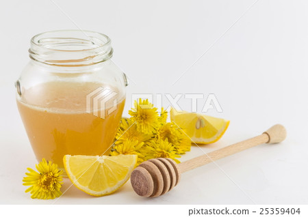 Jar of honey, yellow dandelion and lemons Jar of honey, yellow dandelion and lemons 25359404