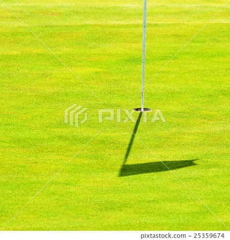 Nice golf course on a sunny summer day. Hole. 25359674