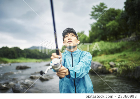 A man who enjoys fly fishing A man who enjoys fly fishing 25360998