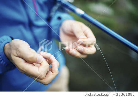 A man who enjoys fly fishing 25361093