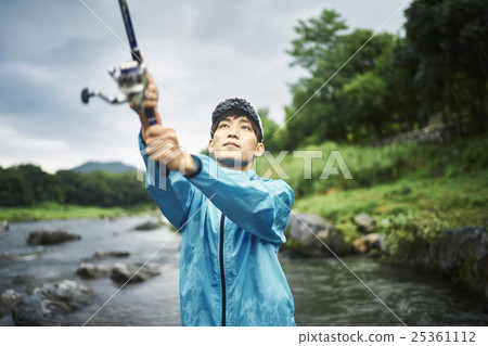 A man who enjoys fly fishing 25361112