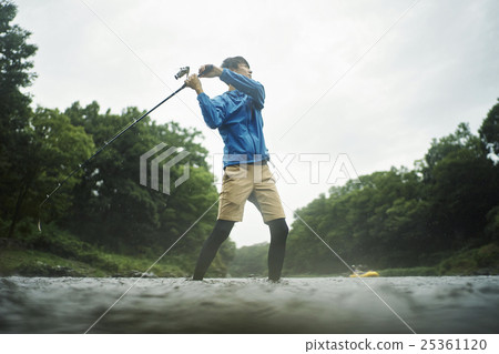 A man who enjoys fly fishing A man who enjoys fly fishing 25361120