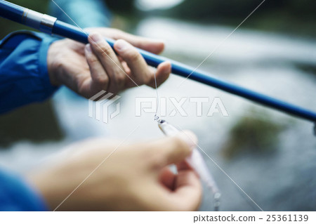A man who enjoys fly fishing A man who enjoys fly fishing 25361139