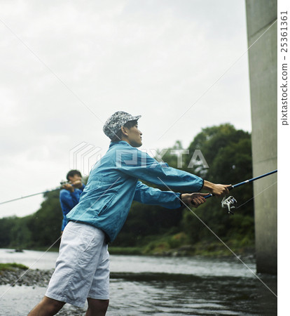 A man who enjoys fly fishing 25361361