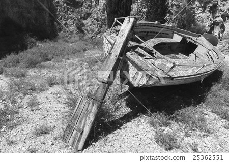 Old abandoned wooden fishing boat on coast 25362551