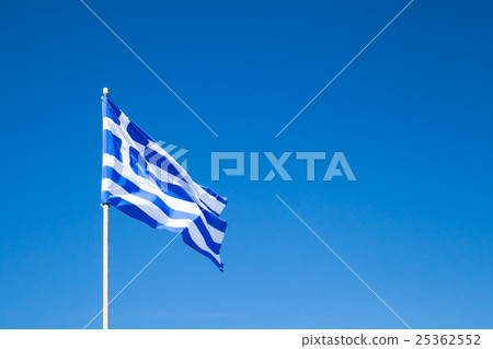 Flag of Greece waving on flagpole over blue sky 25362552