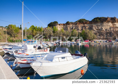 White wooden boats moored in small port 25362593