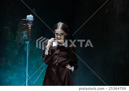 Portrait of a young girl in school uniform as a 25364709