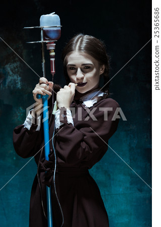 Portrait of a young girl in school uniform as a 25365686