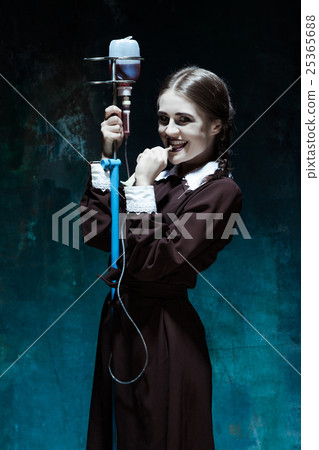 Portrait of a young girl in school uniform as a 25365688