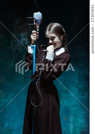 Portrait of a young girl in school uniform as a Portrait of a young girl in school uniform as a 25365691