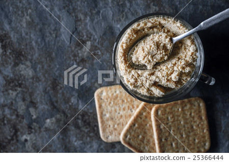 图库照片: cracker crumbs in the glass cup on the stone