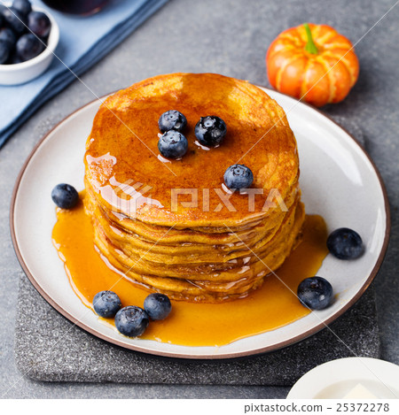 Pumpkin pancakes with maple syrup and blueberries 25372278