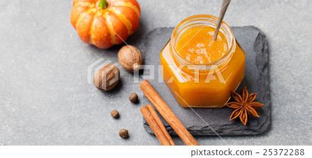 Pumpkin confiture, jam, sauce, spices Stone table 25372288