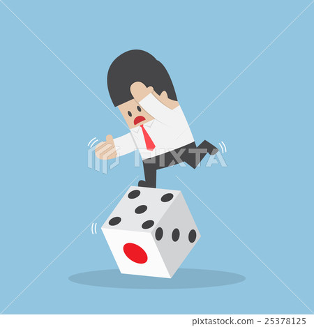 Businessman standing on unstable dice 25378125