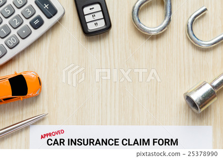 Approved car insurance claim form with car key 25378990