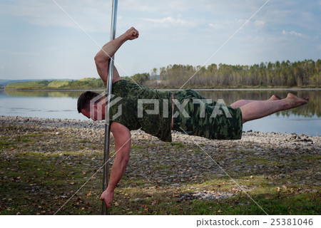 guy dancing on a pole guy dancing on a pole 25381046