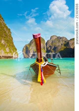 Longtail Boat Tied to Tropical Beach in Thailand Longtail Boat Tied to Tropical Beach in Thailand 25383608