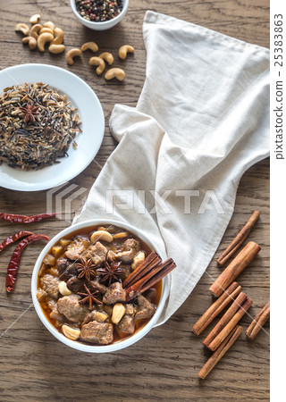 Thai Massaman Curry on the wooden background Thai Massaman Curry on the wooden background 25383863