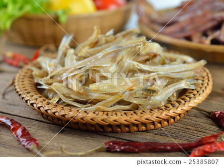 dried fish on wooden background dried fish on wooden background 25385807
