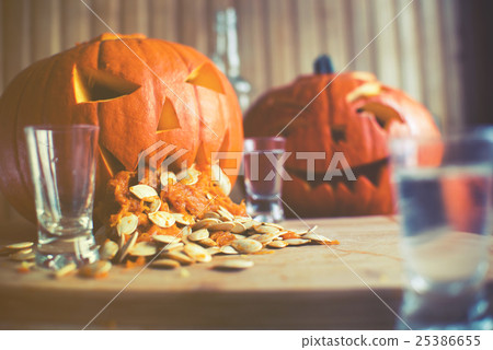 Pumpkin puking with pumpkin seeds on wood table Pumpkin puking with pumpkin seeds on wood table 25386655