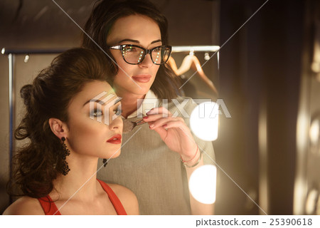 Professional beautician doing facial make-up 25390618