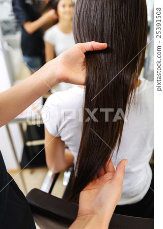 barber working with her customer barber working with her customer 25391508