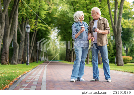 Old husband and wife walking in nature Old husband and wife walking in nature 25391989