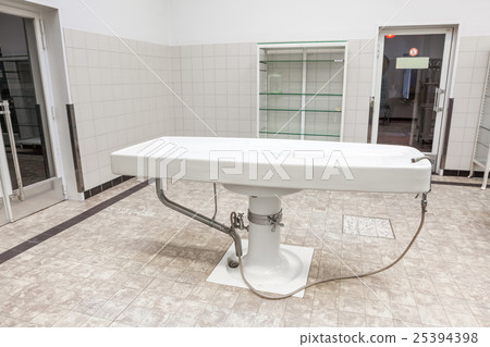 Autopsy tables in morgue 25394398