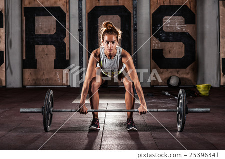 girl doing heavy deadlift exercise girl doing heavy deadlift exercise 25396341