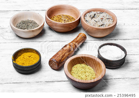 Spices in wooden bowl 25396495