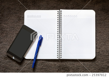 Paper Note with pen and mobile on the carpet 25397812