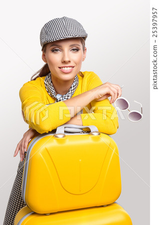 Vintage woman with yellow suitcase. travel concept Vintage woman with yellow suitcase. travel concept 25397957