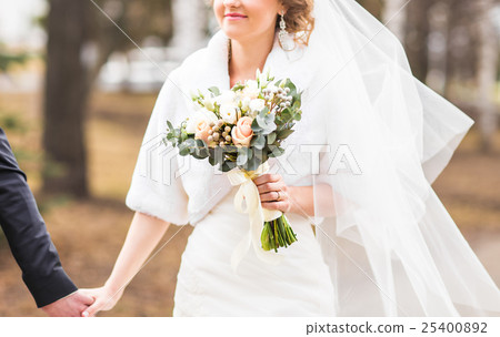 closeup of bride hands holding beautiful wedding closeup of bride hands holding beautiful wedding 25400892