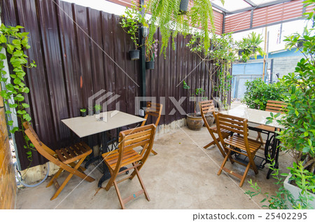 Outdoor coffee shop with tables and chairs 25402295