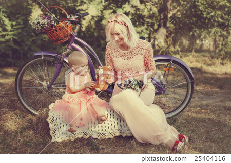 Mom gives a child toy. 25404116