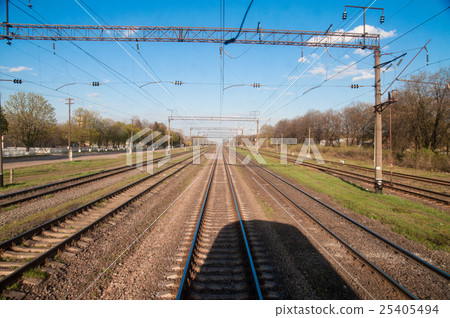 view of the railroad tracks from the last car 25405494