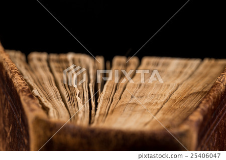 ancient book shot on black background ancient book shot on black background 25406047